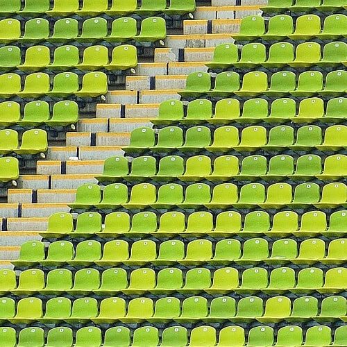 A Olympic Stadium With Green Seats