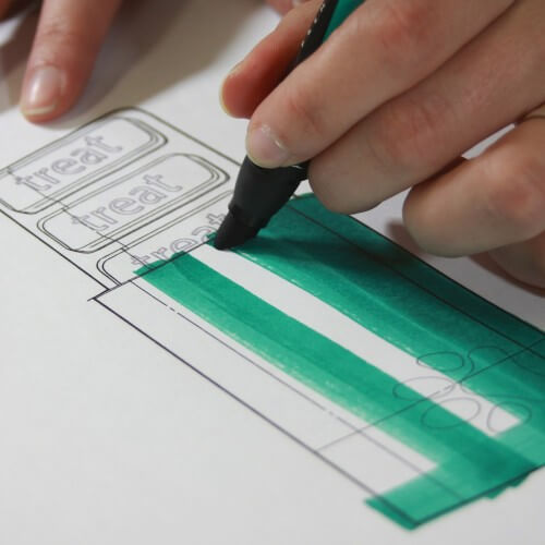 A Person Drawing A Package Design