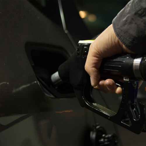 A Person Filling Up Their Car With Petrol