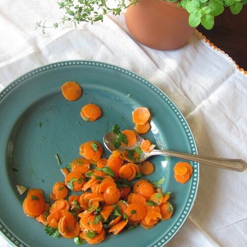A Plate With Thinly Sliced Carrots & Herbs