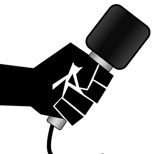 A Graphic Of A Hand Holding A Microphone