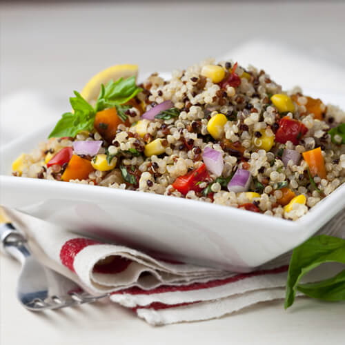 A Bowl Of Grains With Vegetables