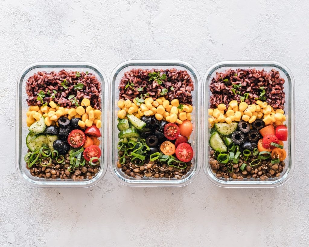 Three Meal Prep Boxes Containing A Healthy Meal
